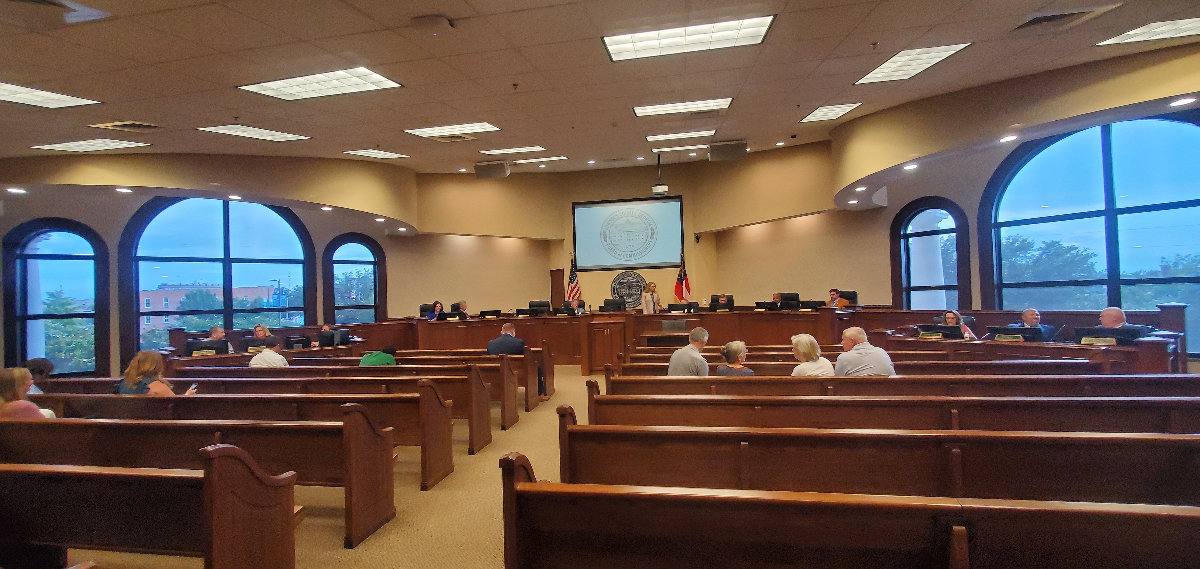 Commissioners, staff, and audience